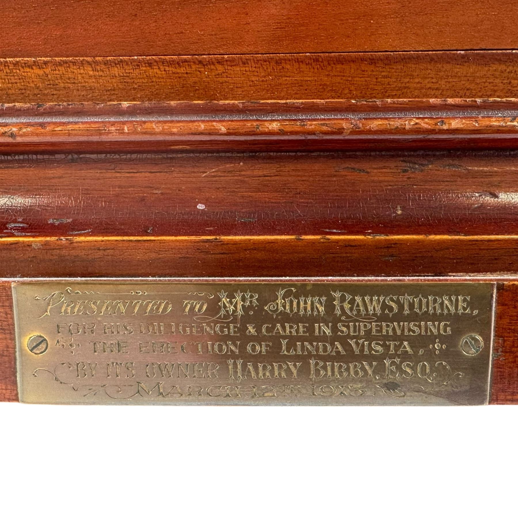 Gustav Becker, German 20th century 8-day mahogany cased mantle clock, break arch mahogany case with a round topped door flanked by reeded pilaster with Ionic capitals and raised on a stepped plinth, the dial with engraved Roman numerals, with steel fleur di Lis hands, and  chime /silent dial, H43cm