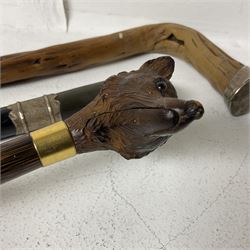 19th century painted bamboo walking cane, the handle carved as a fox with glass eyes, with gilt metal stamped LB, together with an ebonised wooden walking stick, with horn pommel and hallmarked silver collar and a curved wooden walking stick, with monogrammed white metal cap, tallest L90cm