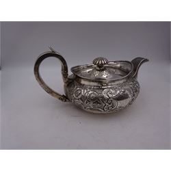 George III Irish silver teapot, of squat circular form, the body with repousse and chased floral and C scroll decoration, with capped C handle and ivory insulators, engraved to base 'Presented to Troop Sergeant Major John Percival, of the 4th Dragoon Guards by Alex D. Tait, Esq, late Captain in that corps as a mark of approbation of his steady and upright conduct when Sergeant Major of his Troop, Dublin, June 2nd 1843', hallmarked William Law, Dublin 1817, H12.5cm, This item has been registered for sale under Section 10 of the APHA Ivory Act