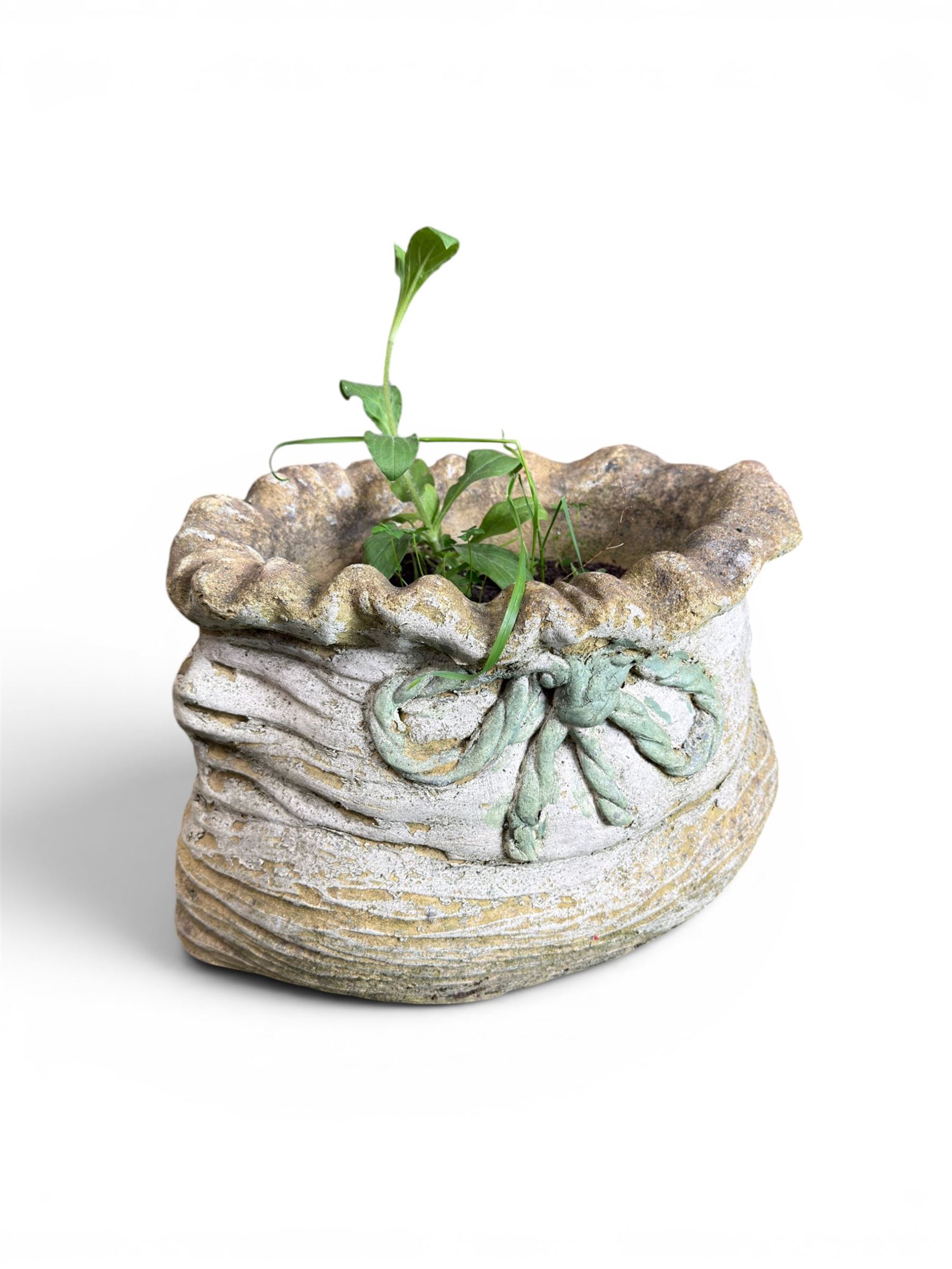 Four cast stone garden planters in the form of ribbon tied planting sacks