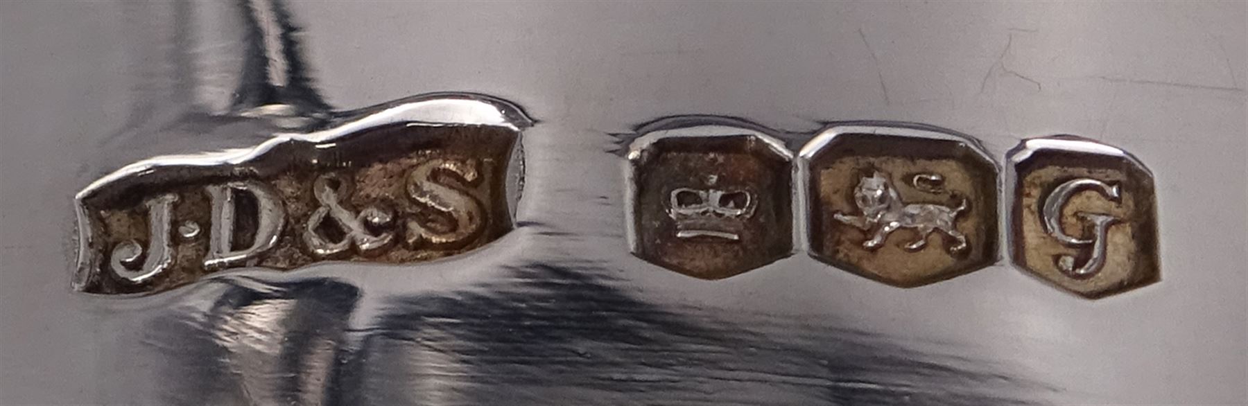 Modern limited edition silver goblet to commemorate the 350th anniversary of the Act of Parliament founding the Company of Cutlers, the tapering cylindrical bowl engraved with crest, with gilt interior and upon parcel gilt textured knopped stem and pierced circular foot, hallmarked James Dixon & Sons, Sheffield 1974, number 21/210 , in original fitted box with paperwork