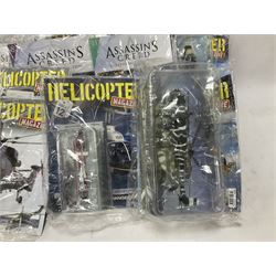 Fifteen Amer Czechoslovakia periodical issued metal models of helicopters each in unopened original packaging with copy of 'Helicopter Magazine'; together with seven unopened Hachette 'Assassin's Creed' periodical figures with magazines (22)