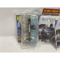 Fifteen Amer Czechoslovakia periodical issued metal models of helicopters each in unopened original packaging with copy of 'Helicopter Magazine'; together with seven unopened Hachette 'Assassin's Creed' periodical figures with magazines (22)