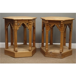  Pair pine Gothic style tables, hexagonal top above carved Gothic arches with under tiers, plinth bases, D71cm, H75cm  