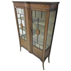 Edwardian inlaid mahogany display cabinet, projecting moulded cornice over frieze inlaid with bellflower and ribbon festoons, enclosed by two astragal glazed doors, on splayed square tapering supports