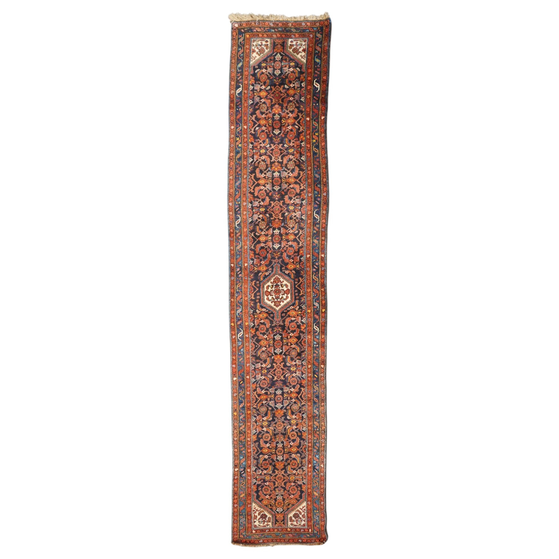 Large vintage Persian Hamadan indigo ground runner rug, the busy field with central ivory medallion and spandrels, surrounded with Herati motifs and stylised plant symbols, with multiple floral decorated guard bands