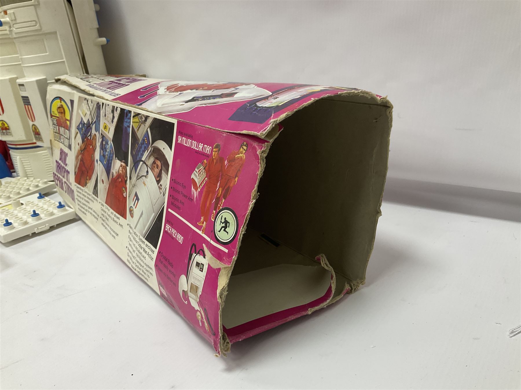 Six Million Dollar Man - two 1975 Bionic Transport and Repair Stations with related figures, further accessories and boxes