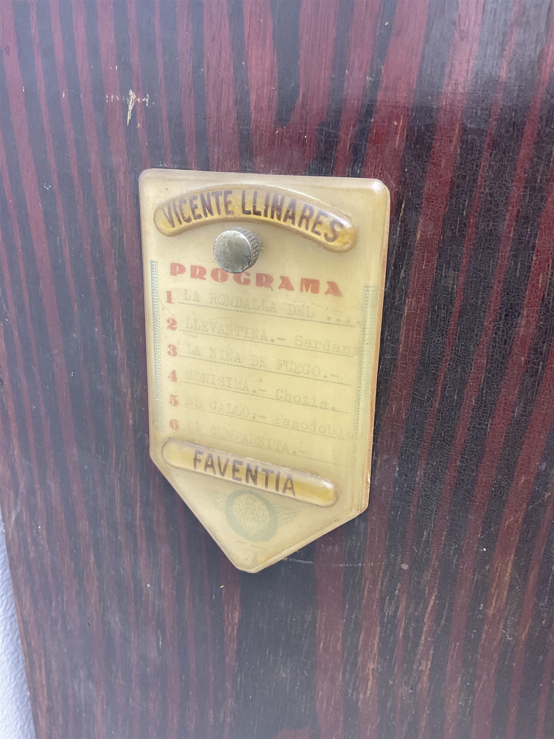 Faventia Half size miniature Spanish barrel piano with a 40cm cylinder playing tunes on a 37 note movement including woodblock and triangle, in a painted case with silk embroidered decoration to the front.  Vicente Linares, Barcelona trade label, with original crank handles, stringing, hammers action, tuning pins and cylinder