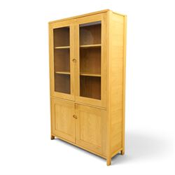 Ercol - contemporary oak 'Bosco' display cabinet, fitted with two shelves enclosed by glazed doors, over two cupboard doors, raised on stile feet