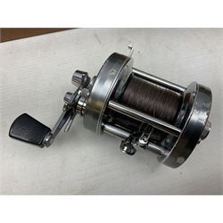 Four Abu fishing reels, comprising Ambassadeur 9000, Ambassadeur 7000, Ambassadeur 5500 and Ambassadeur 6500, together with additional line, hardy fishing bag and two wooden boxes