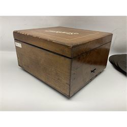 Late 19th century Symphonion disc musical box for spares or repair, inlaid walnut case with front lever action, playing 25.5cm discs on a 10.5cm steel comb with forty-nine teeth, musical scene of cherubs under the lid, L33cm; together with twelve 25.5cm discs
