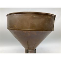 Agricultural copper corn funnel, H32.5cm, another similar copper funnel and copper warming platter of oval form, with twin handles on four supports, with removeable warming plate, L49cm