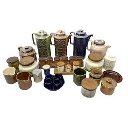 Hornsea pottery tea wares and kitchenalia, to include saffron pattern spice pots in a wooden rack, coral pattern coffee pot and milk jug, pennine pattern tea and coffee storage jars, three heirloom pattern coffee pots in blue, green and brown, etc