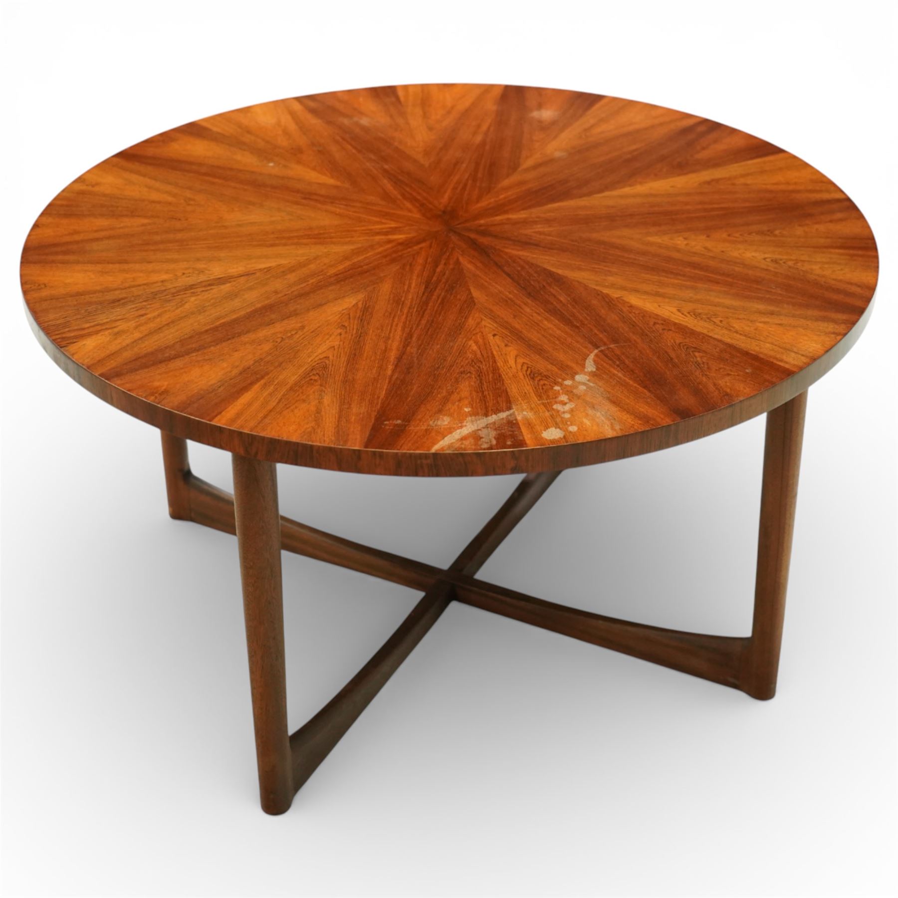 McIntosh of Kirkcaldy - Mid 20th century circular teak coffee table, circular top with book-matched radial veneers forming a starburst pattern and plain edge, raised on four tapered supports united by a shaped stretcher frame