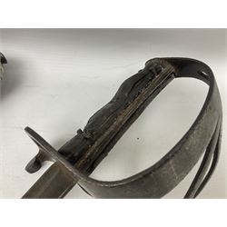 George V British Army 1897 pattern officers sword with plain 82cm fullered steel blade, pierced  basket hilt with George V cypher and wire bound leather grip with chequered backstrap; in leather covered field service scabbard L101cm overall; and another officer's sword in relic condition lacking scabbard (2)