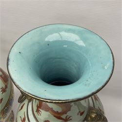 Pair of early 20th century Chinese vases decorated with dragons chasing a flaming pearl, with a gilt border of butterflies and floral sprigs, with Elephant head handles, H44cm 