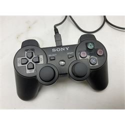 Sony PlayStation 3 60GB console with one PS3 controller, two PS2 controllers, BD remote control, PSP handheld gaming console with case, GAMEware PSP essentials pack, and a selection of PS2, PS3 and PSP games in original cases with instruction booklets 