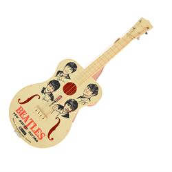 1960s Selcol 'The Beatles New Sound Guitar', plastic toy guitar, in brown faux fur case, H58.5cm