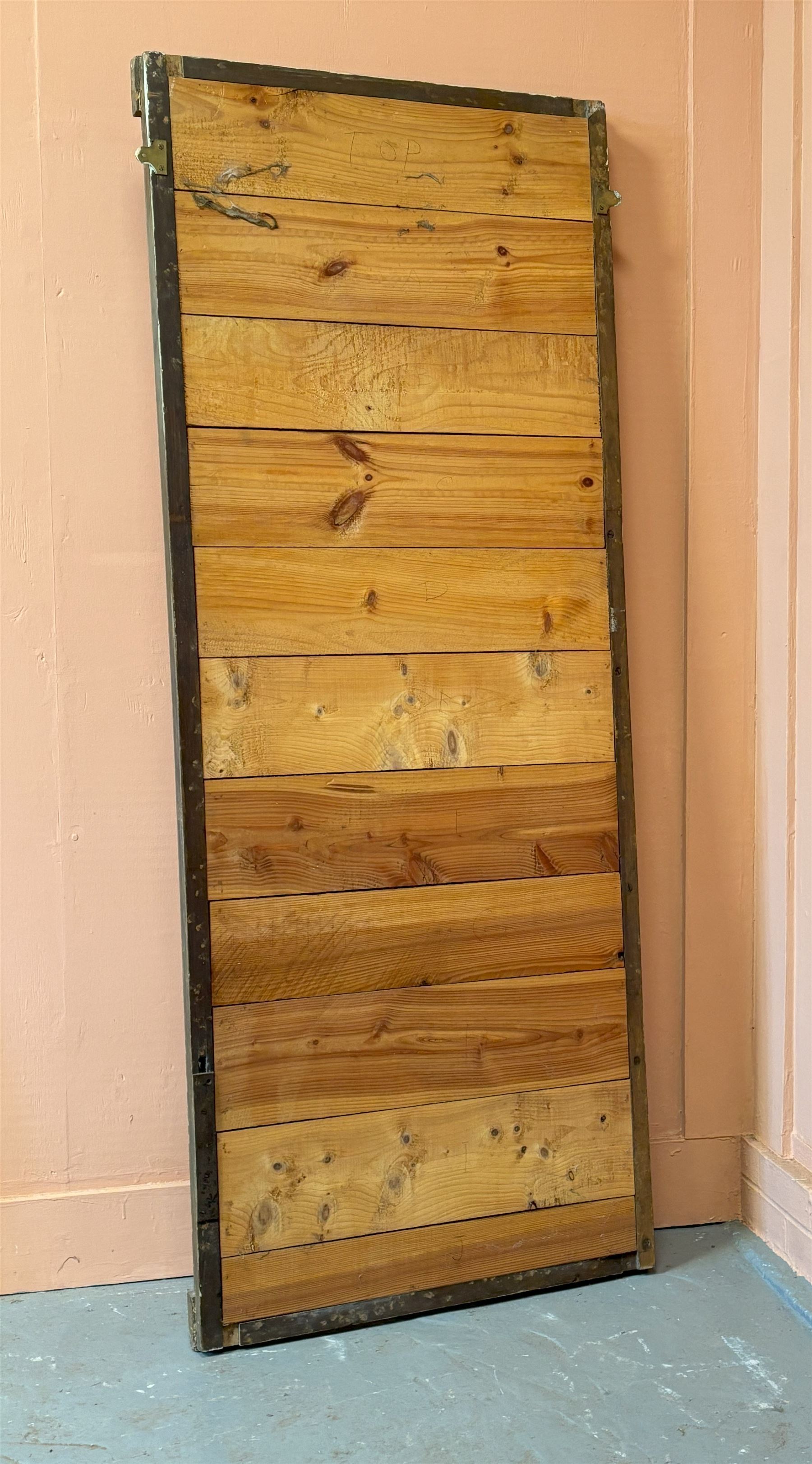 Edwardian giltwood and composition framed upright wall mirror, having a floral boss to each corner united by flowerhead decoration, enclosing an original distressed mirror plate. 193cm x 77cm.  - COLLECTION BY APPOINTMENT FROM: The White House, Thirsk Road, Easingwold, York, YO61 3NF - CALL 01723 507111 TO ARRANGE