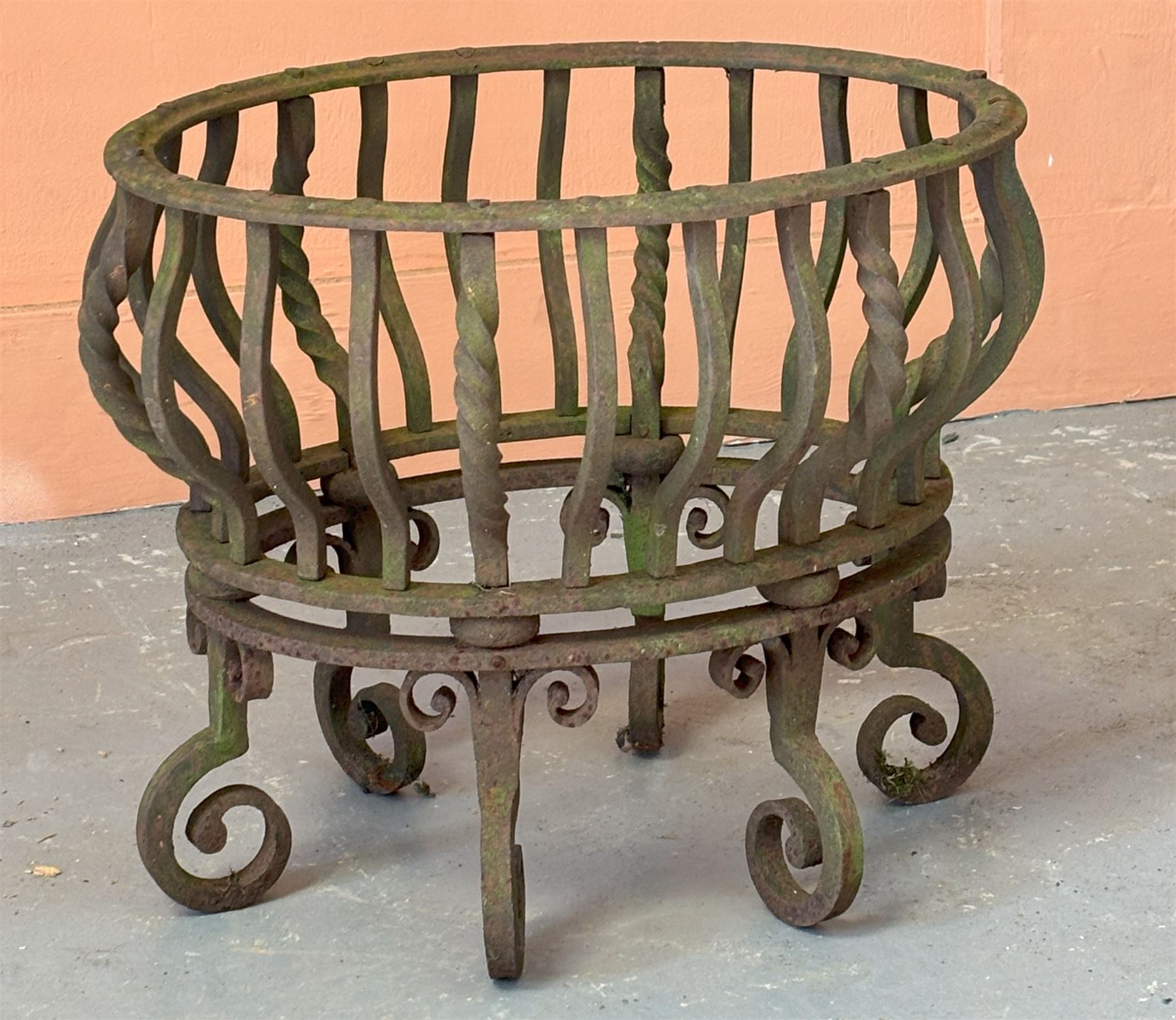Wrought iron dog grate of oval outline, raised on six scrolled supports. H42cm, W52cm, D41cm.  - COLLECTION BY APPOINTMENT FROM: The White House, Thirsk Road, Easingwold, York, YO61 3NF - CALL 01723 507111 TO ARRANGE