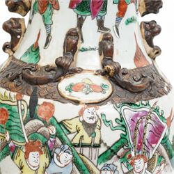 Pair of late 19th/Early 20th century Cantonese baluster vases decorated with warriors and mythical beast handles on a white ground H44cm 