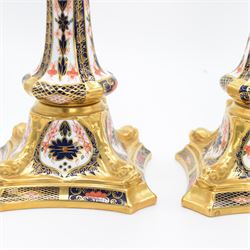Pair of Royal Crown Derby Imari 1128 pattern candlesticks with printed marks beneath including year cypher for 1987, second quality, H27cm 