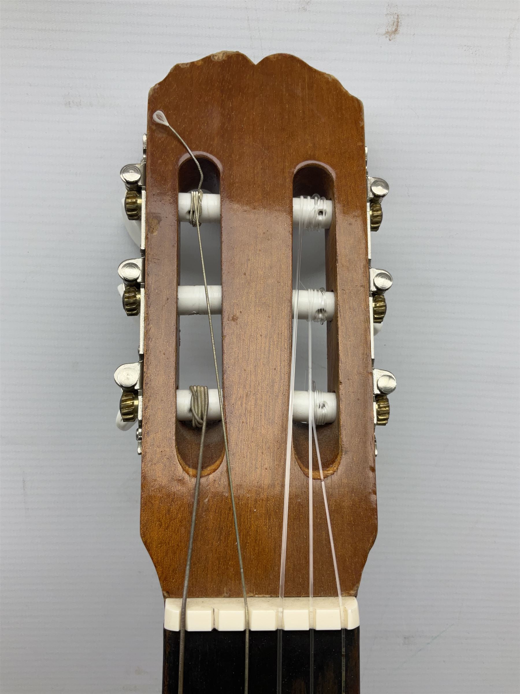 Spanish BM acoustic guitar with mahogany back and sides and spruce top L101cm; in cello carrying case; Roland foot pedal and two Yamaha foot pedals; tin D# organ pipe; folding music stand etc