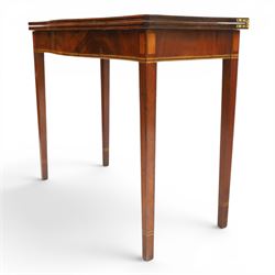Regency period inlaid mahogany serpentine-fronted fold-over tea table, the shaped rectangular top with ebony-strung edge over a banded frieze with repeating lozenge inlaid banding, on square tapering supports