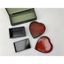  Late 19th / early 20th century Japanese lacquered table top cabinet, heavily decorated with mother of pearl inlay depicting blossoming branches, flowers and birds, the two hinged doors between longer drawers opening to reveal interior fitted with four short drawers, with lift up hinged canted lid, H28cm D9.5cm W23cm, together with mother of pearl inlaid miniature folding screen, dish decorated with walking figures with crimped edge, boxes decorated with flowers, birds and gilt etc