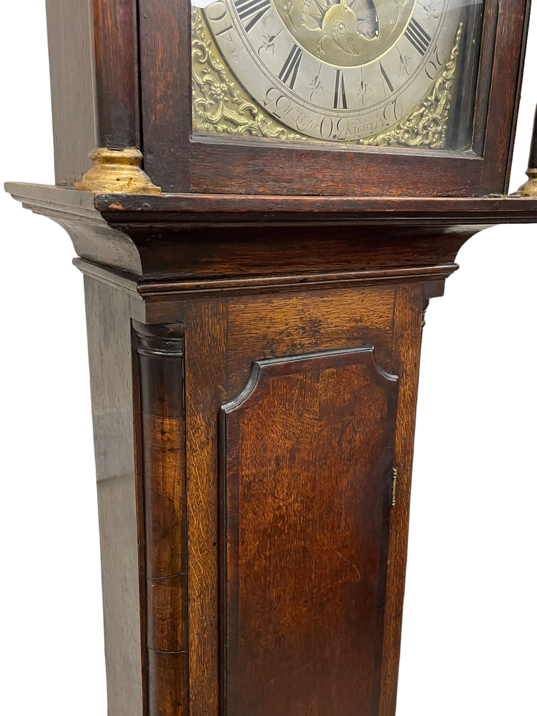 William Lister (II) of Keighley – 8-day 18th century oak cased longcase clock c1760, hood with a break front flat topped pediment and eglomise  frieze beneath, square hood door flanked by matching pilasters with gesso capitals, trunk with quarter columns and long trunk door with a flat top and convex shoulders, square plinth with a decorative skirting, 12” brass dial with rococo spandrels, engraved dial center, silvered chapter with Roman numerals, five minute Arabic’s, half hour markers and minute track, semi-circular apertures with engraved calendar and moon phase/lunar age discs, original blue steel fretted hands, four pillar rack striking movement with a recoil anchor escapement, striking the hours on a bell. With pendulum, weights and key.
The Lister family were a prolific family of clockmakers working in the West Riding of Yorkshire during the 18th century. Working in various locations including Halifax, Keighley and Luddenden.
William Lister (I) is recorded as working in Keighley from 1715-37 and his son William (II) from 1735-1785.
