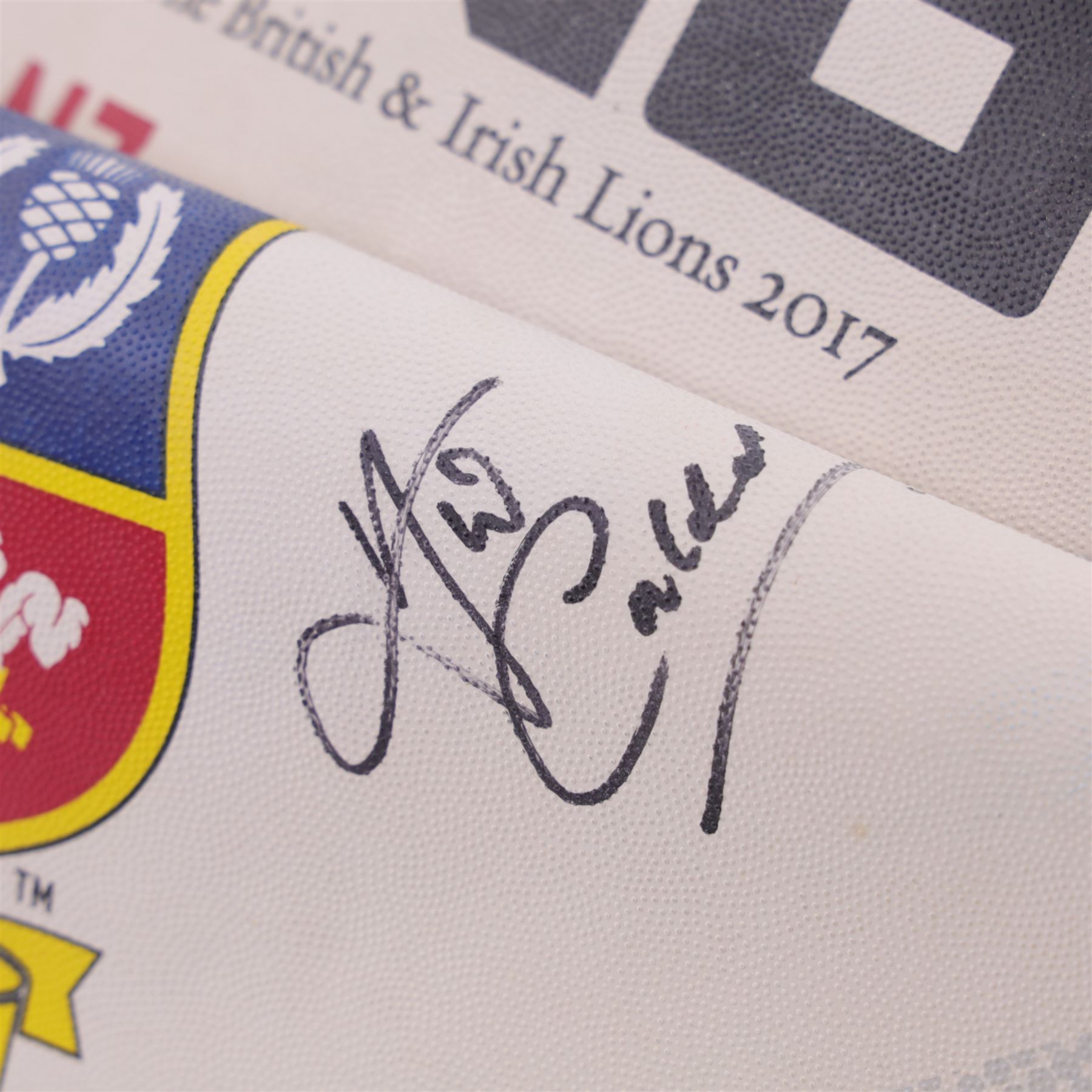 Three signed rugby balls, including 2017 Lions Tour Rhino Jumbo ball, signed by eight players, including Greig Laidlaw, Rugby world cup 2003 example and a 2001 British Lions example