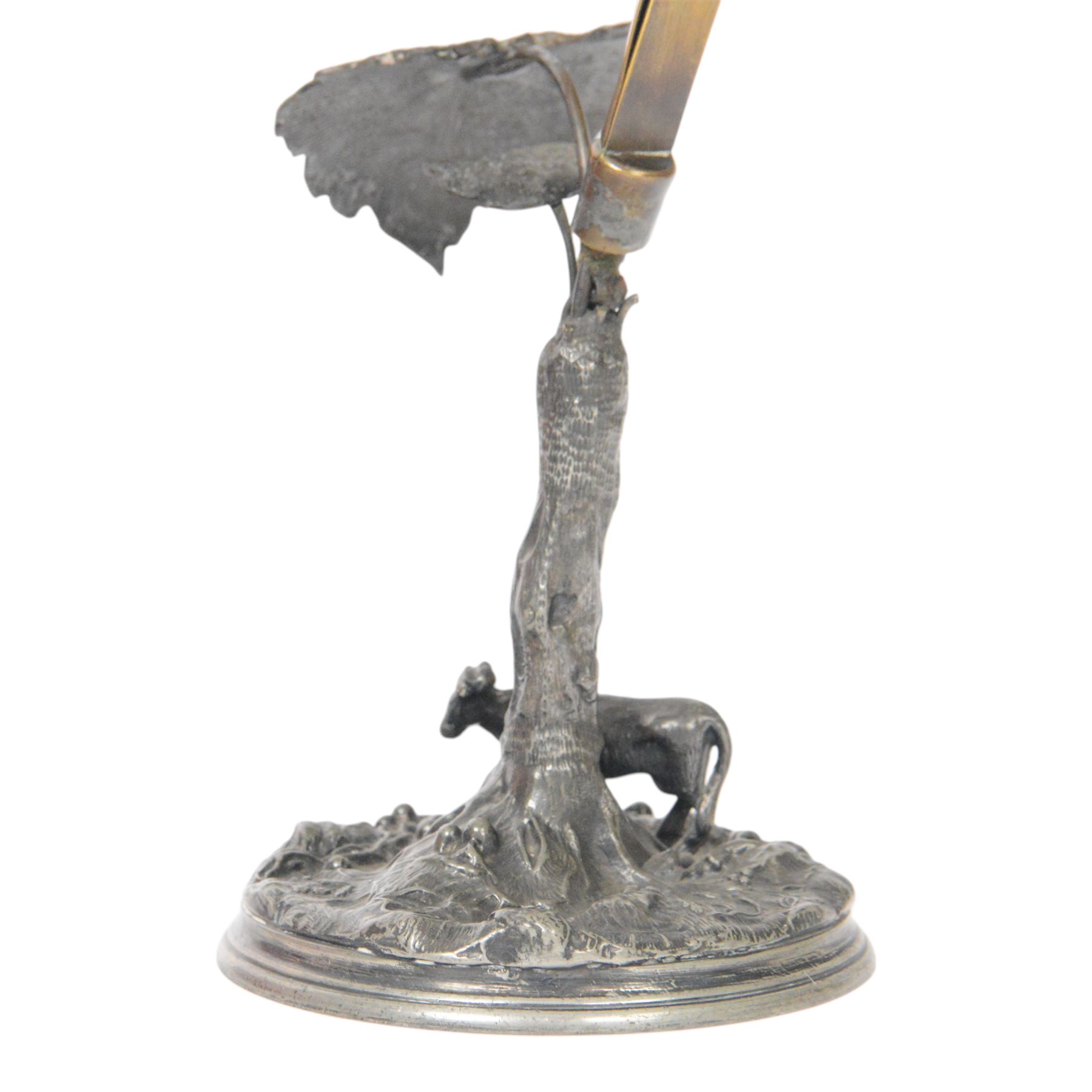 19th century silver plated desk holder, the circular naturalistically modelled base cast with fruiting vines and with applied figure of a ram, rising to a vine with two leaves, and initialled brass clip, H18cm