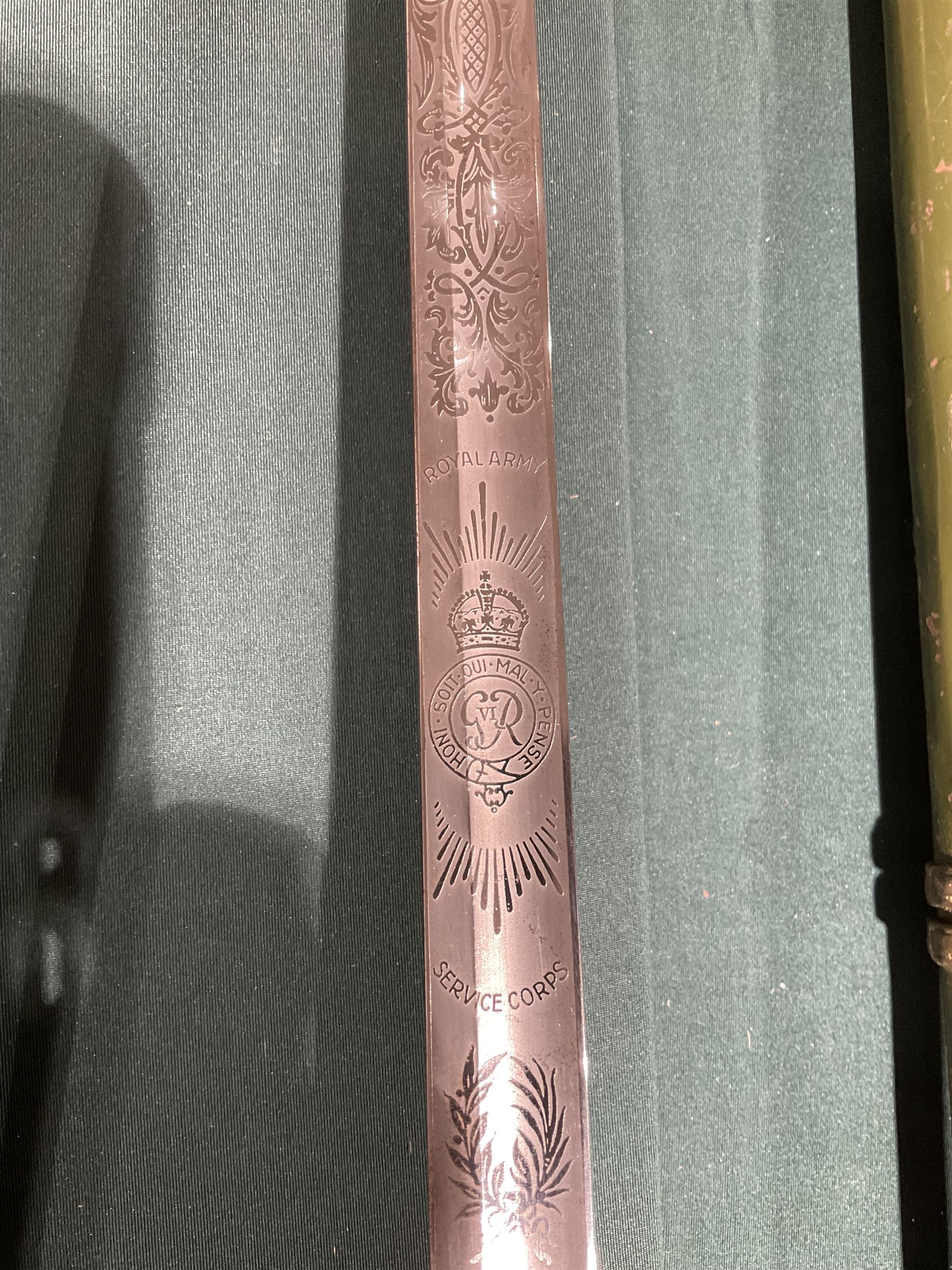 George VI Royal Army Service Corps Officer's sword, with 87cm steel blade, wirebound fishskin grip, chequered backstrap and stepped domed pommel, in brown leather scabbard, overall L102cm