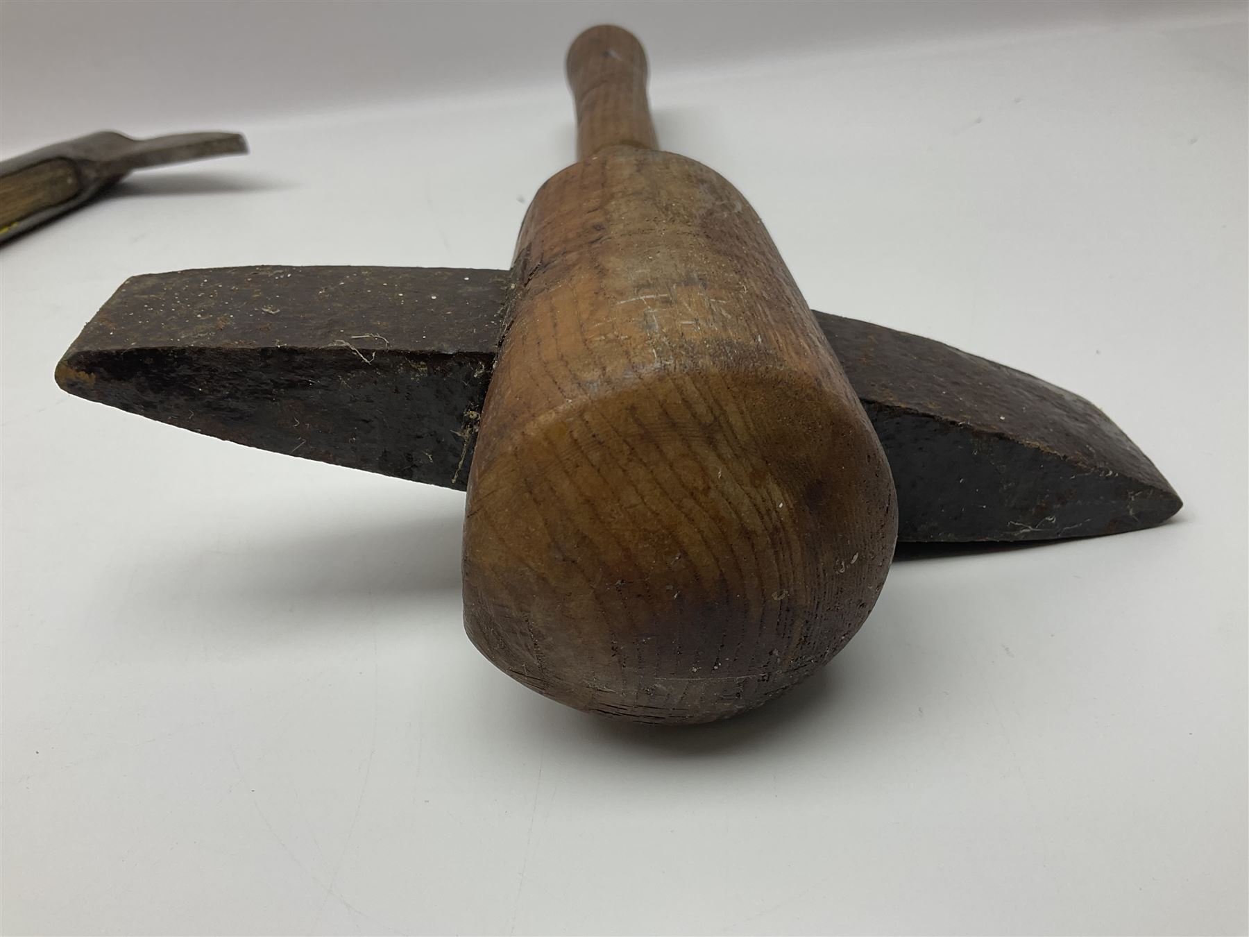 Post-War military type fireman's axe impressed 'PERKS 1953/54' with additional indistinct mark probably WD arrow, ash handle L39cm; and another stonemason's(?) double headed axe with mallet shaped shaft (2)