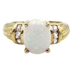 9ct gold single stone opal ring with white topaz shoulders,    hallmarked 