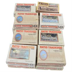 Twenty-two Ratio Trackside Series unbuilt 00 gauge model railway building kits, including two 522 Engine Sheds, thirteen 515 Platform Canopies, five 502 Cattle Docks, 540 Locomotive Servicing Depot and 529 Oil Depot, together with a collection of Ratio Trackside unbuilt accessory kits, including gutters, pipes, window arches, etc all boxed or carded