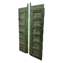 Pair of green-painted Indian doors, c.1860–1880, made from solid teak featuring original iron work and hand-painted finish