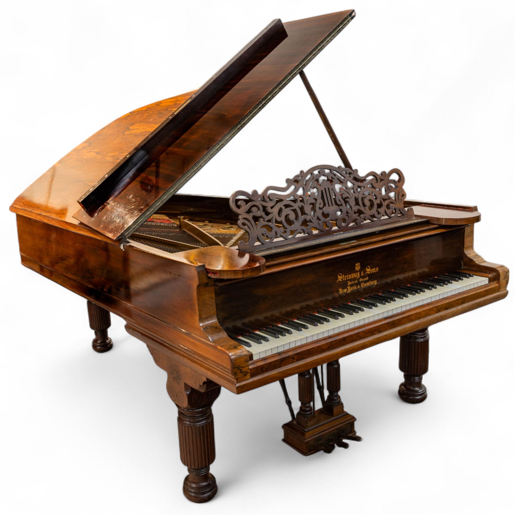 Steinway & Son, New York & Hamburg- Model B, overstrung Drawing Room Grand Piano in a rosewood case, Serial No 87297 (1896/7), with 85 ivory covered and ebony keys A0-A7(7 octaves) with an adjustable fretted music desk, brass fittings and pedals, Steinway “Fireplug” straight columnar and fluted legs with roller castors and conforming lyre, duplex stringing with agraffs, bass strings copper wound with a steel core, steel tuning pins, original Steinway action, hammers, keys, felts, and dampers, with una-corda, sostenuto and sustain pedals, Overstrung iron frame detailing numerous Steinway patents, awards, and features. Tuned to Concert pitch (A=440). 
With an adjustable single stool. 

This item has been registered for sale under Section 10 of the APHA Ivory Act HLB1KY67