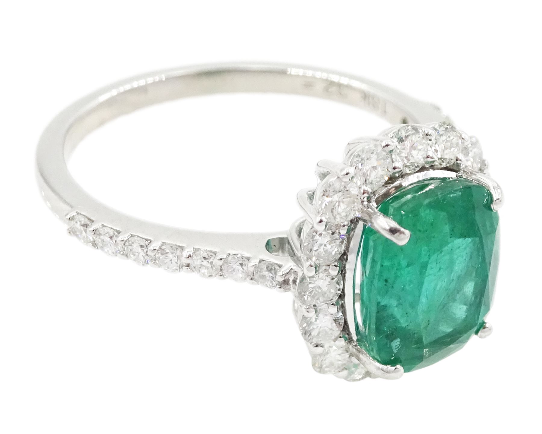 18ct white gold cushion cut emerald and round brilliant cut diamond cluster ring, with diamond set shoulders, stamped, emerald approx 2.30 carat