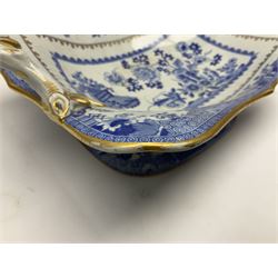 Early 19th century Spode dessert set, circa 1805-1830, blue and white transfer printed in the Grasshopper pattern, comprising comport of oblong form with twin naturalistically modelled branch handles, two oval dishes, and six plates, each with blue or green printed mark beneath, including handles comport H11.5cm W34cm, oval dishes W26.5cm, plates D20.5cm