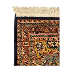 Belgian Sultan woollen ground rug, central navy field densely decorated with floral sprays and geometric patterns (192cm x 135cm); handwoven tribal terracotta ground rug (121cm x 71cm); Persian crimson ground runner, all over stylised floral and foliate motifs (266cm x 94cm)