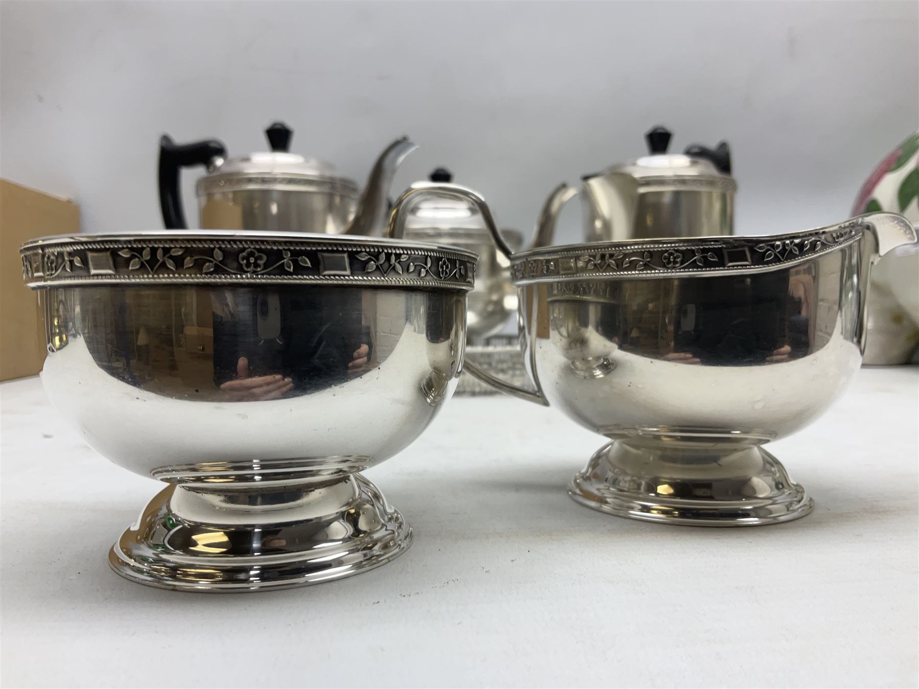Viners of Sheffield silver-plate tea/coffee wares, the rims decorated with bands of flowers, and chased oval tray with swag decorated gallery, L39cm