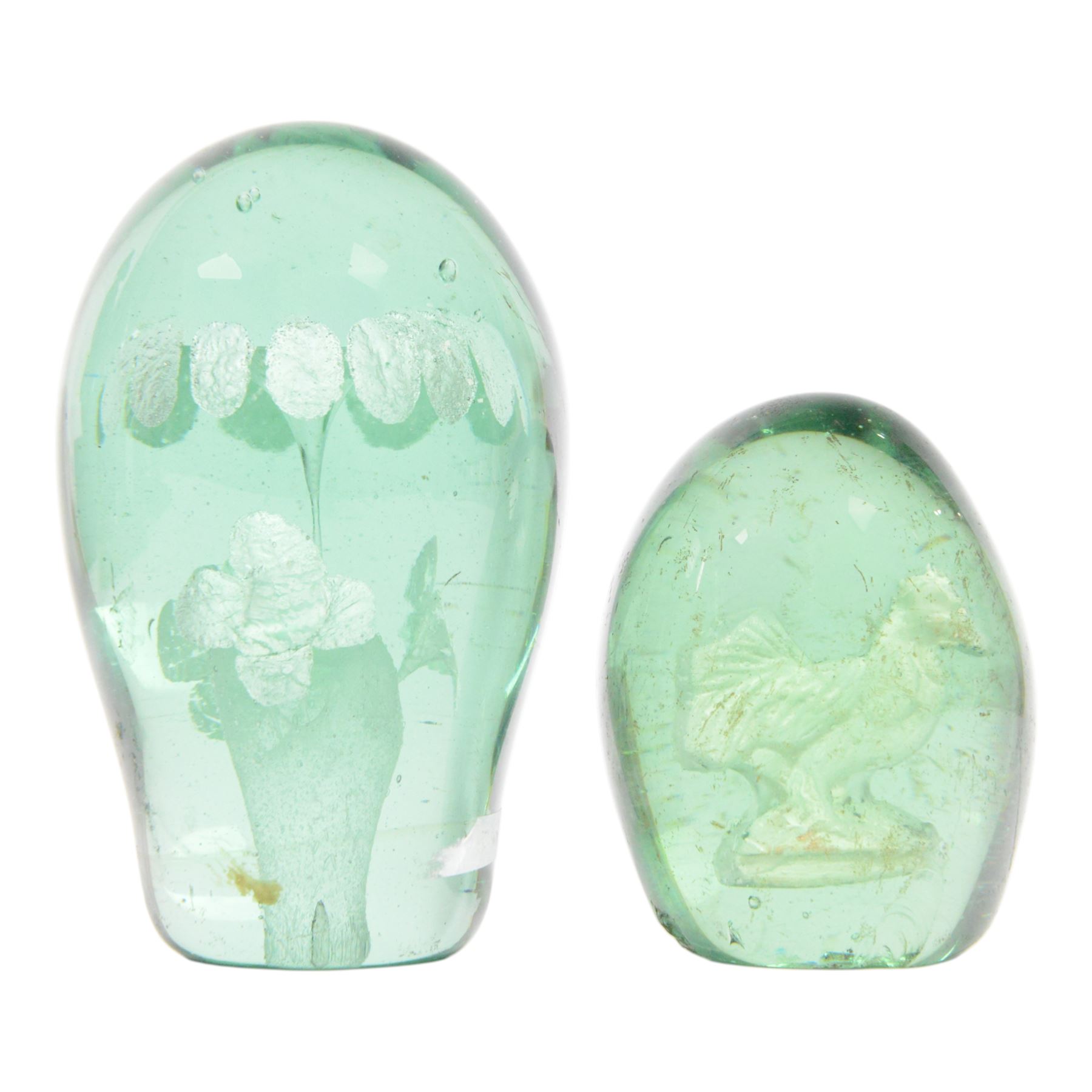Two 19th century green glass dump paperweights, each of globular form, the smaller example with internal sulphide cockerel, H9cm, the larger with internal sulphide floral bloom, H13cm