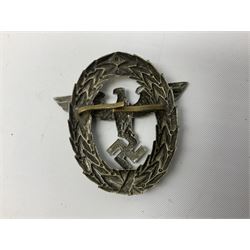Three WW2 German visor cap badges comprising Police eagle, Political leaders eagle and Norwegian Quisling Party; all with fixings; and WW2 Polish visor cap badge (4)