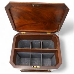 Early 19th century mahogany cellarette, tapering canted rectangular form, the hinged faceted top enclosing fitted interior, panelled front, back and sides with figured mahogany veneers, the canted corner with wide reeded decoration, on canted bracket feet 