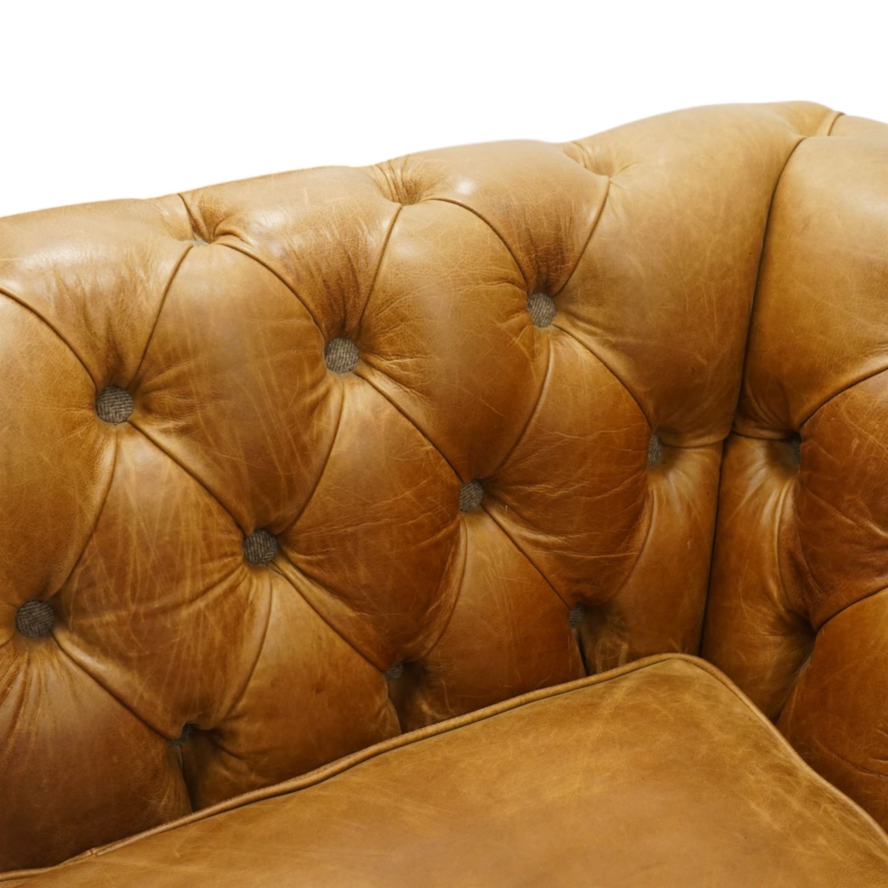 Contemporary Chesterfield design 'Caesar' three seat sofa, traditional shape with out-swept arms, upholstered in tan leather with loose seat cushions, the back, sides and buttons upholstered in chevron stitched Harris Tweed, on turned feet