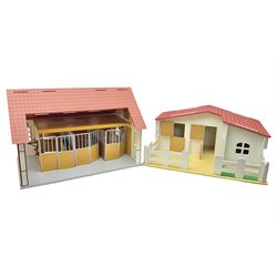 Sectional wooden horse stables playset by Julip with two stalls and tack room under a pitched roof, base 59 x 47cm; and another sectional plastic stables playset by Schleich with three stalls under an open pitched roof, base 56 x 36cm (2)