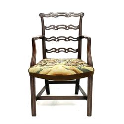 Chippendale style ladder back armchair, shaped reeded arms, supports and stretcher, upholstered in patterned fabric 
