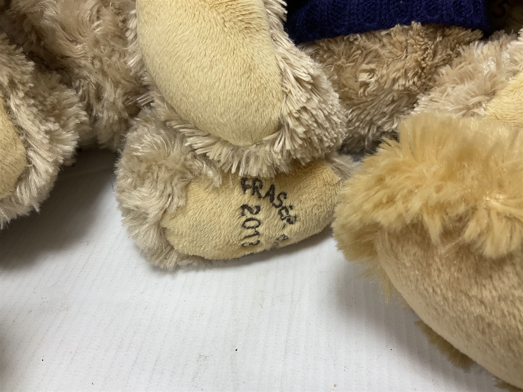 Eight annual Fraser Bears, by House of Fraser, dating between 2012 and 2019, tallest H35cm