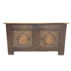 Jacobean Revival - 19th century oak blanket chest, rectangular hinged top, the two front panels carved arched foliate decoration, raised on stile supports